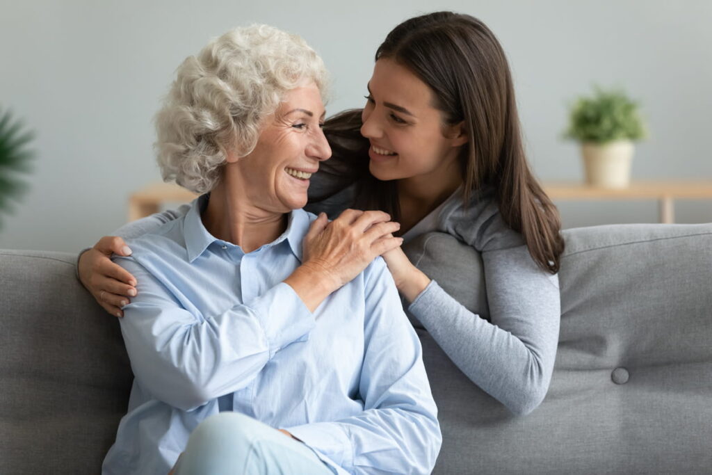 Multi-generational women embracing each other